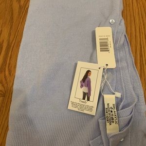 Versatile baby blue shawl.